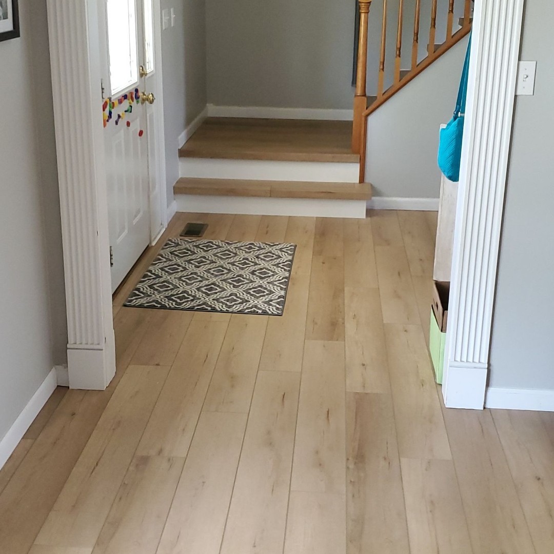 This was an exciting project that involved changing all the various flooring materials on all three levels of their home to the same beautiful material. The stairs were crafted using the same flooring material and turned out stunning! The flooring throughout was Coretec Plus Enhanced Plank 7” color Calypso Oak furnished and installed by Footprints Floors of Greater St. Louis.
