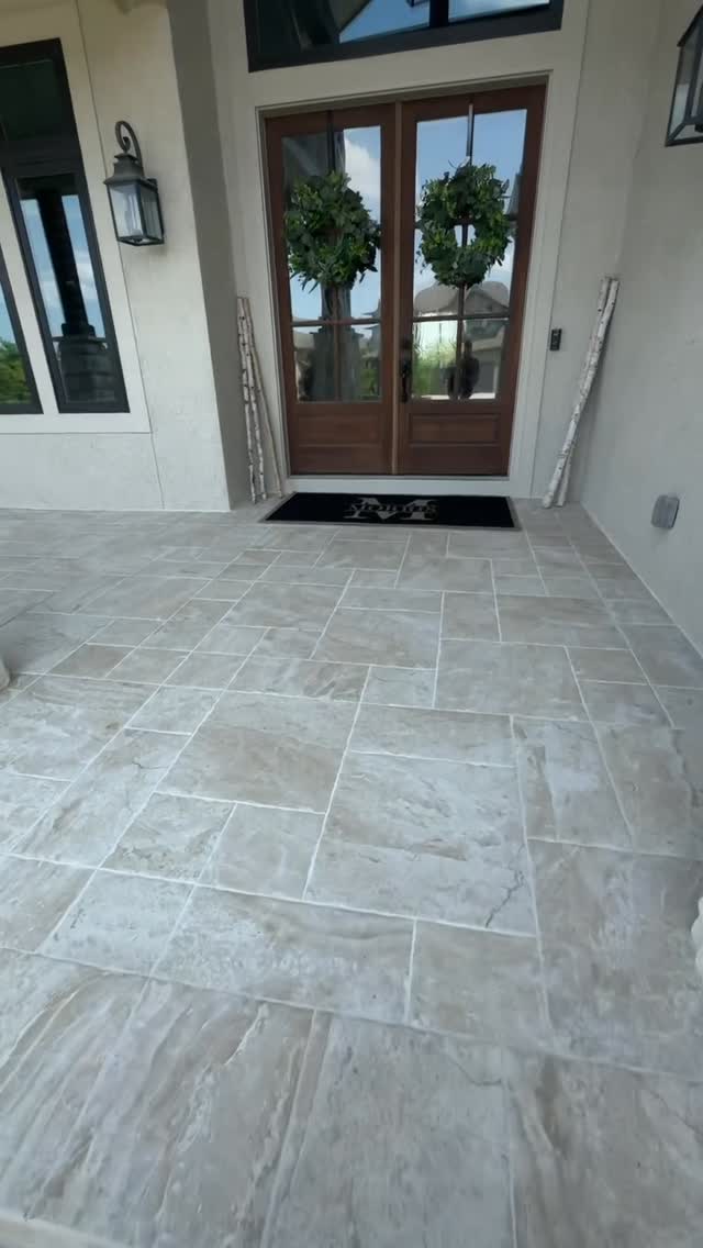 Front porches were made for summer ☀️ We added porcelain tile with a custom pattern to upgrade this beautiful front porch. Let us help you redesign yours! 