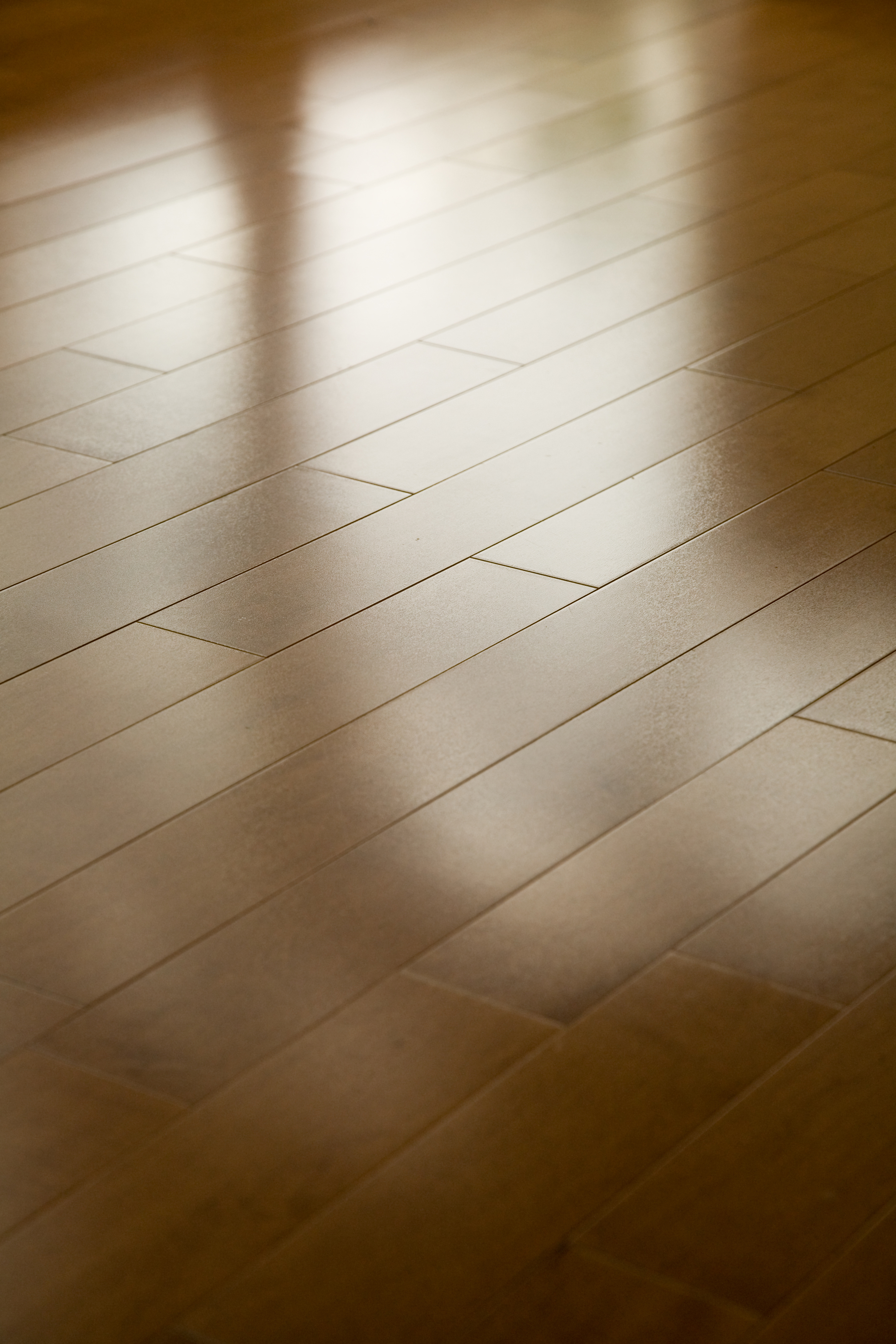 A hardwood floor with a light, natural finish applied by Footprints Floors Greater St Louis professionals.