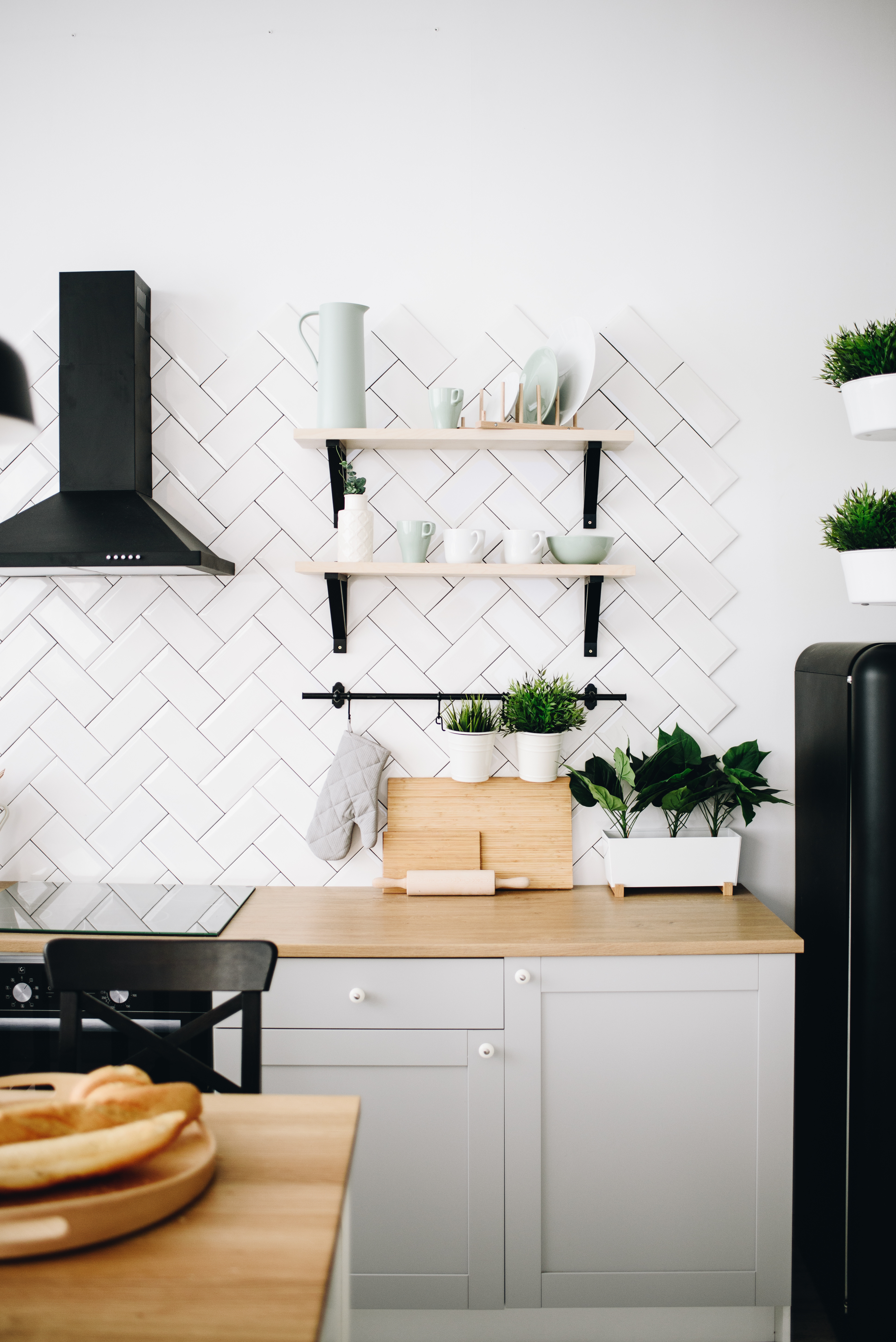 A kitchen with harringbone tile from Footprints Floors's Lawrenceville / Sugar Hill tile installers.