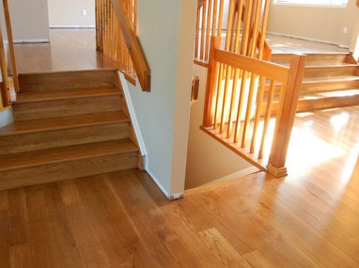 A newly renovated floor and staircase done by Footprints Floors, home services franchise.