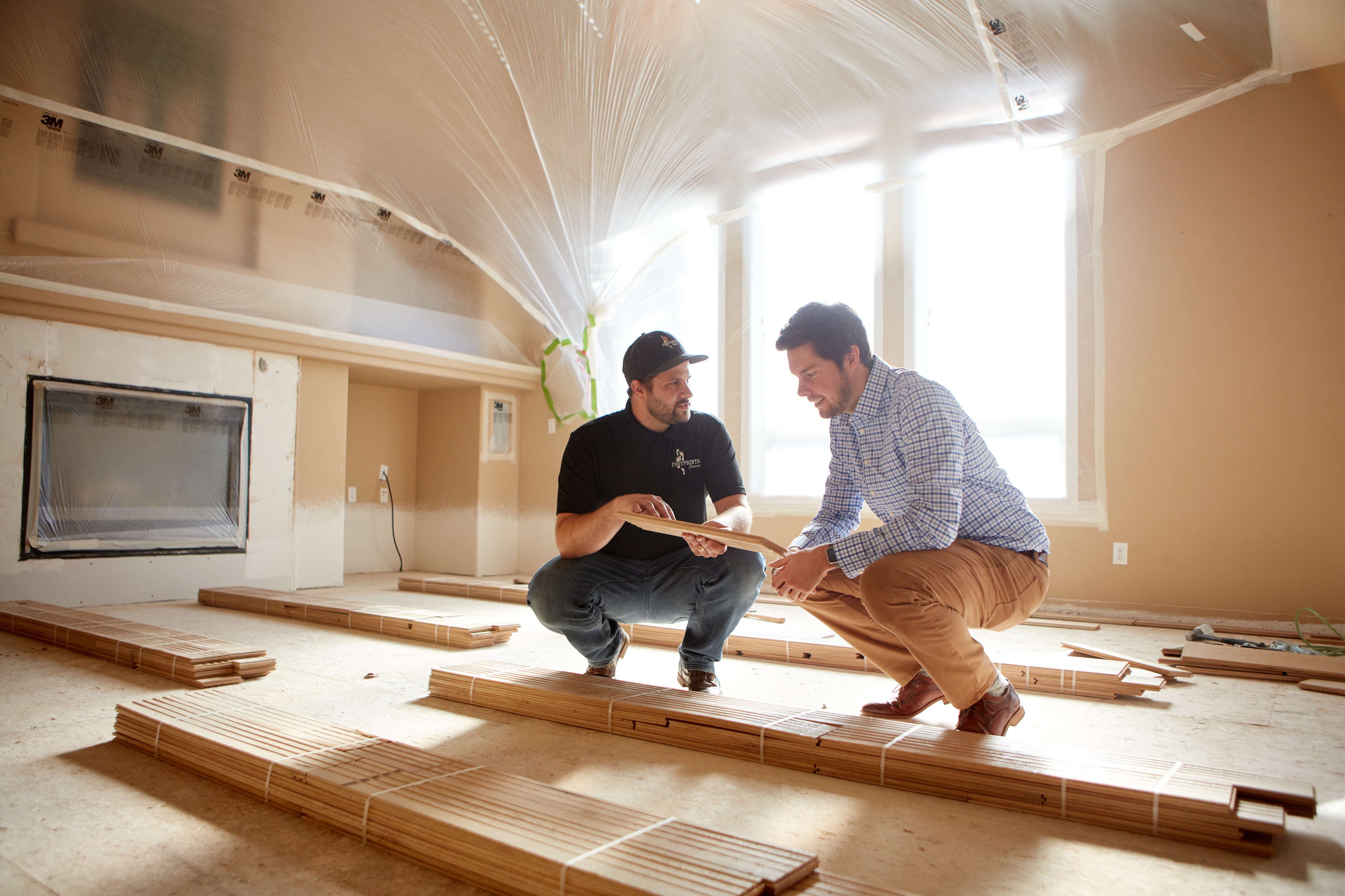A Footprints Floors team member working with a client on their new flooring installation.