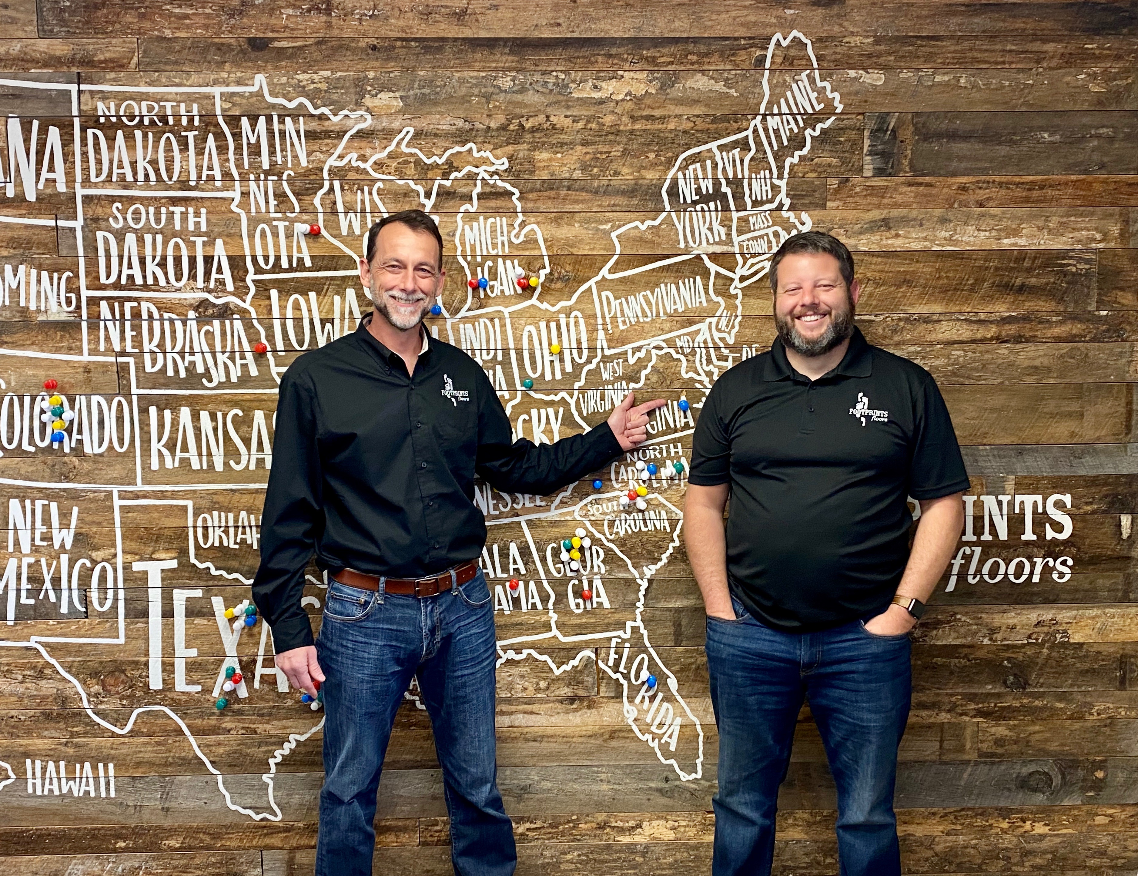 Scott Ogburn at a pin ceremony with Bryan Park, founder and CEO of Footprints Floors.