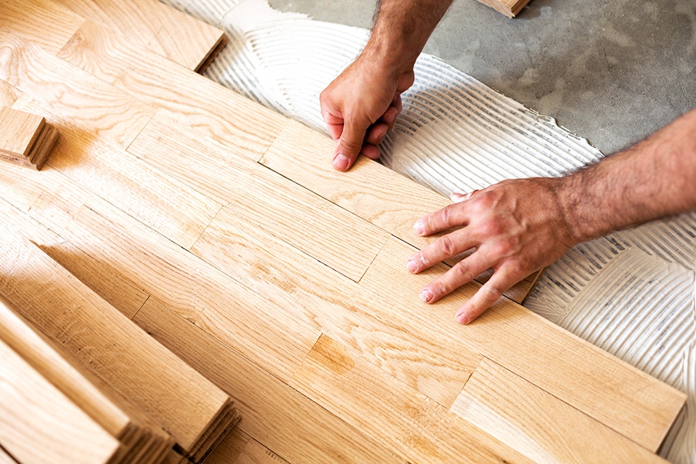New wood flooring being installed in a home - learn more about the home improvement industry.