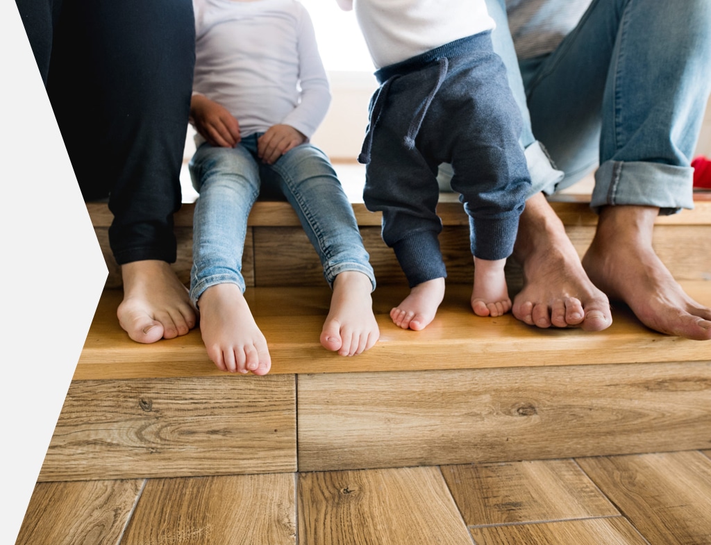 A family sitting on wooden steps. 