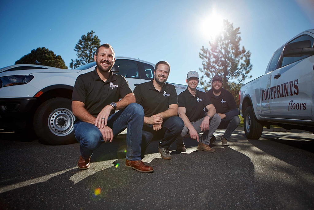 An image of Footprints Floors team members - learn how we support our franchisees with comprehensive marketing support.
