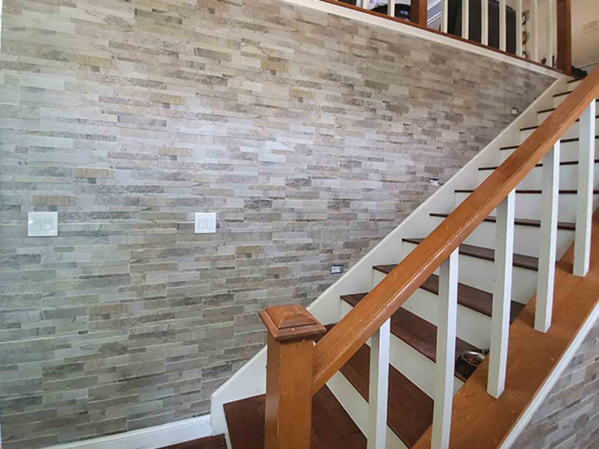 Wood flooring and stone backsplash, installed by Footprints Floors of the MidSouth.