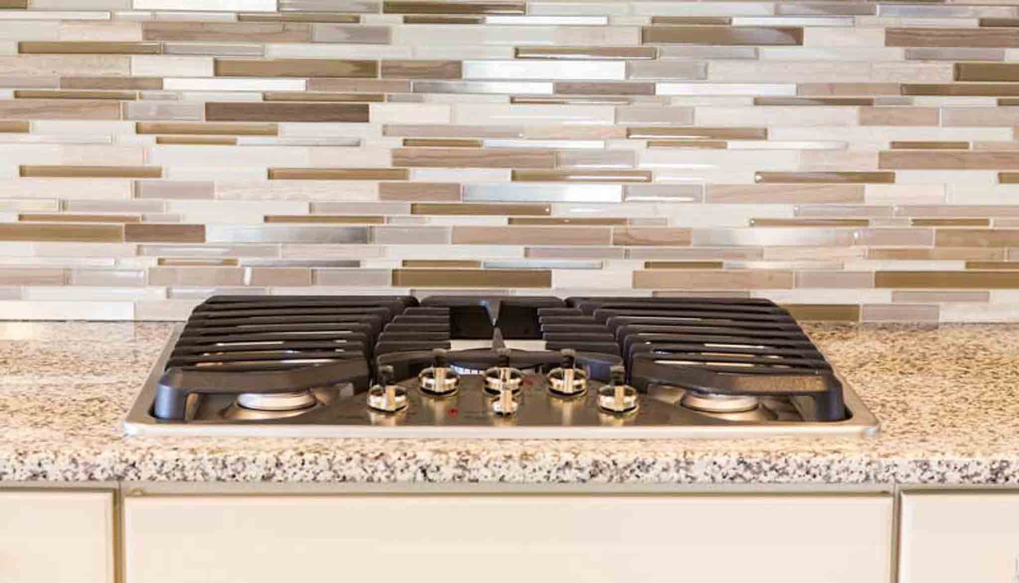 Brown backsplash in a kitchen, installed by Footprints Floors of the MidSouth.