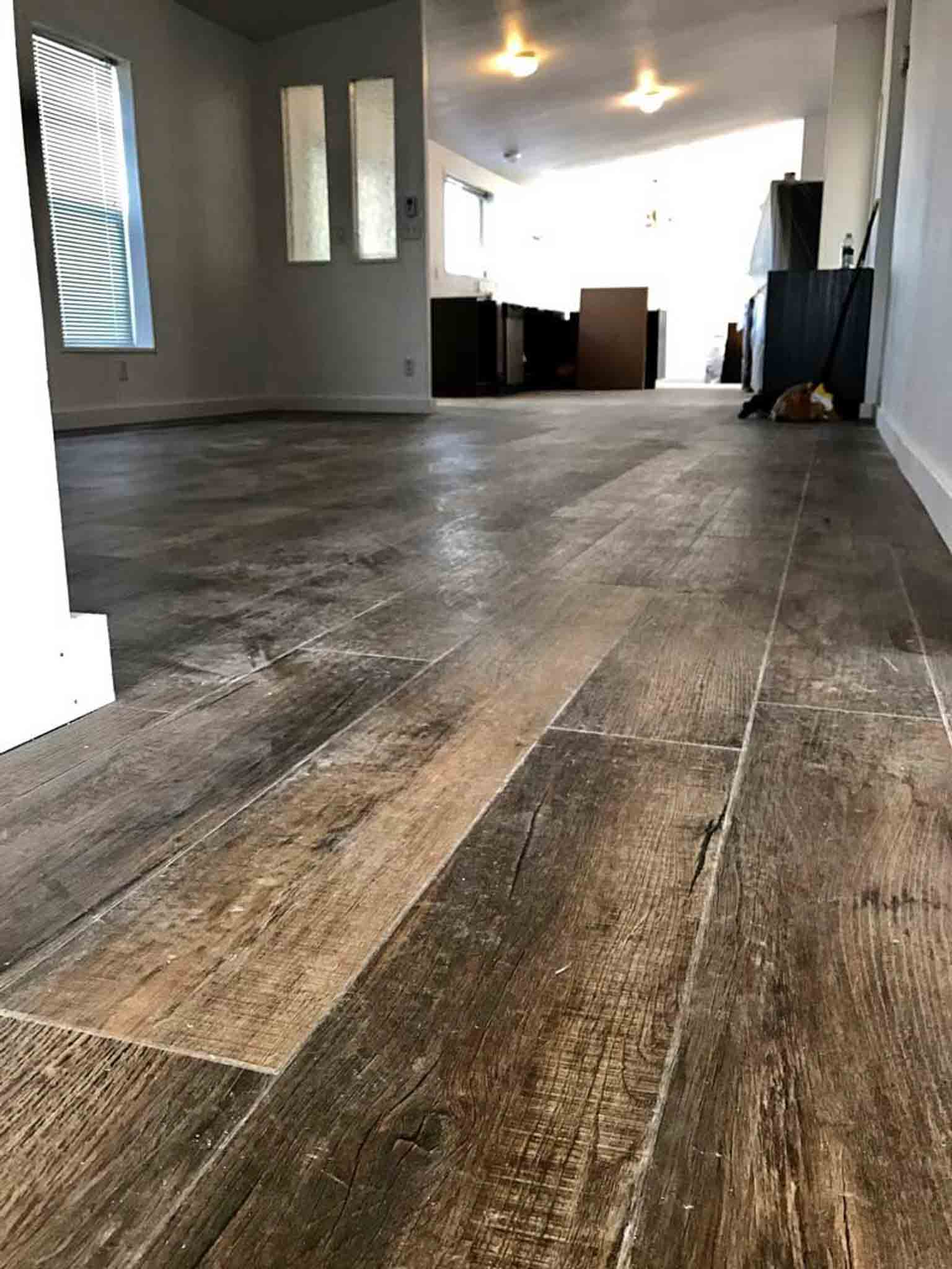 Dark laminate flooring.