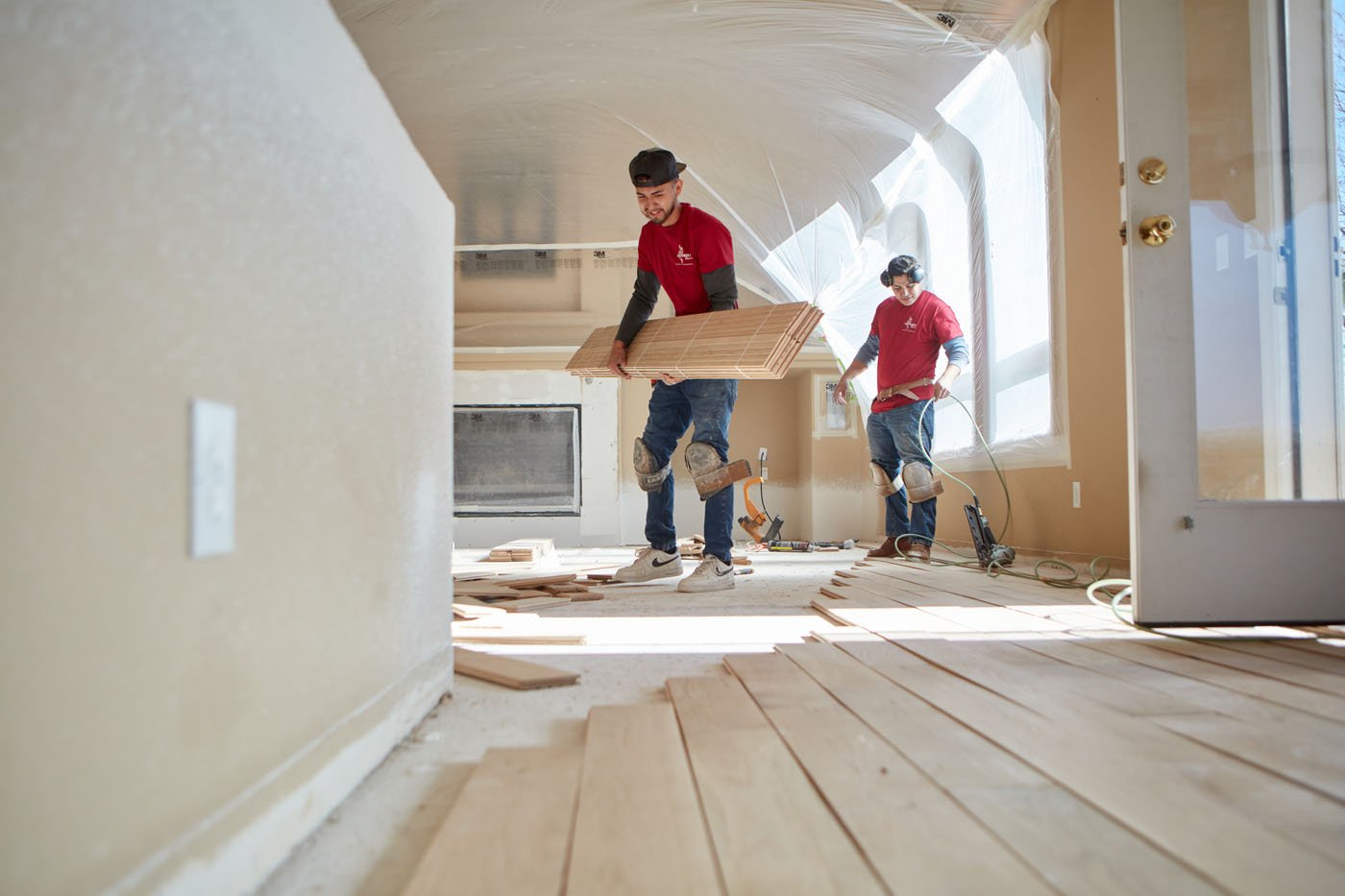 Two Footprints Floors contractors working on a residential flooring project.
