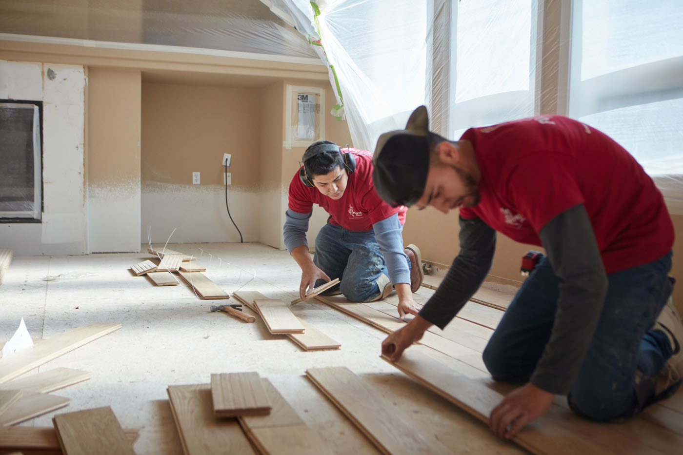 Two Footprints Floors professionals installing new floors in a home - trust us to be your go-to flooring company in Reno-Sparks Metro, NV.