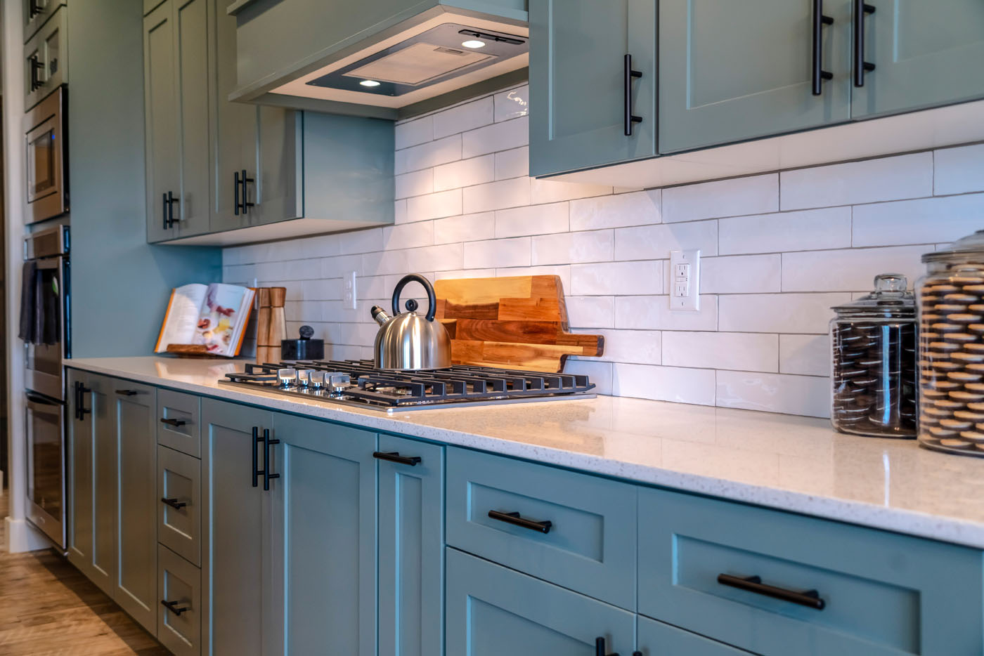 A stunning, modern kitchen with classic subway tile kitchen backsplash installation from Footprints Floors.