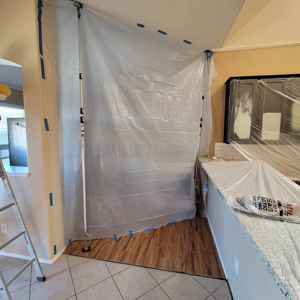 A McKinney / Plano doorway covered by plastic in preparation for dustless demo services.