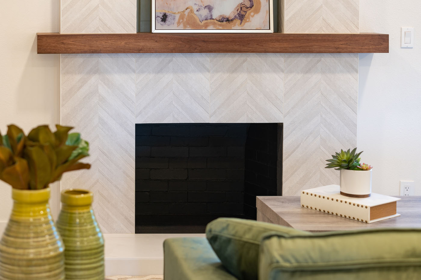 A modern, beautiful fireplace backsplash installed by Footprints Floors.