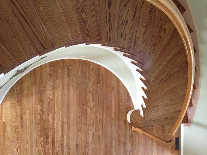 This beautiful spiral staircase was refinished by Footprints Floors.