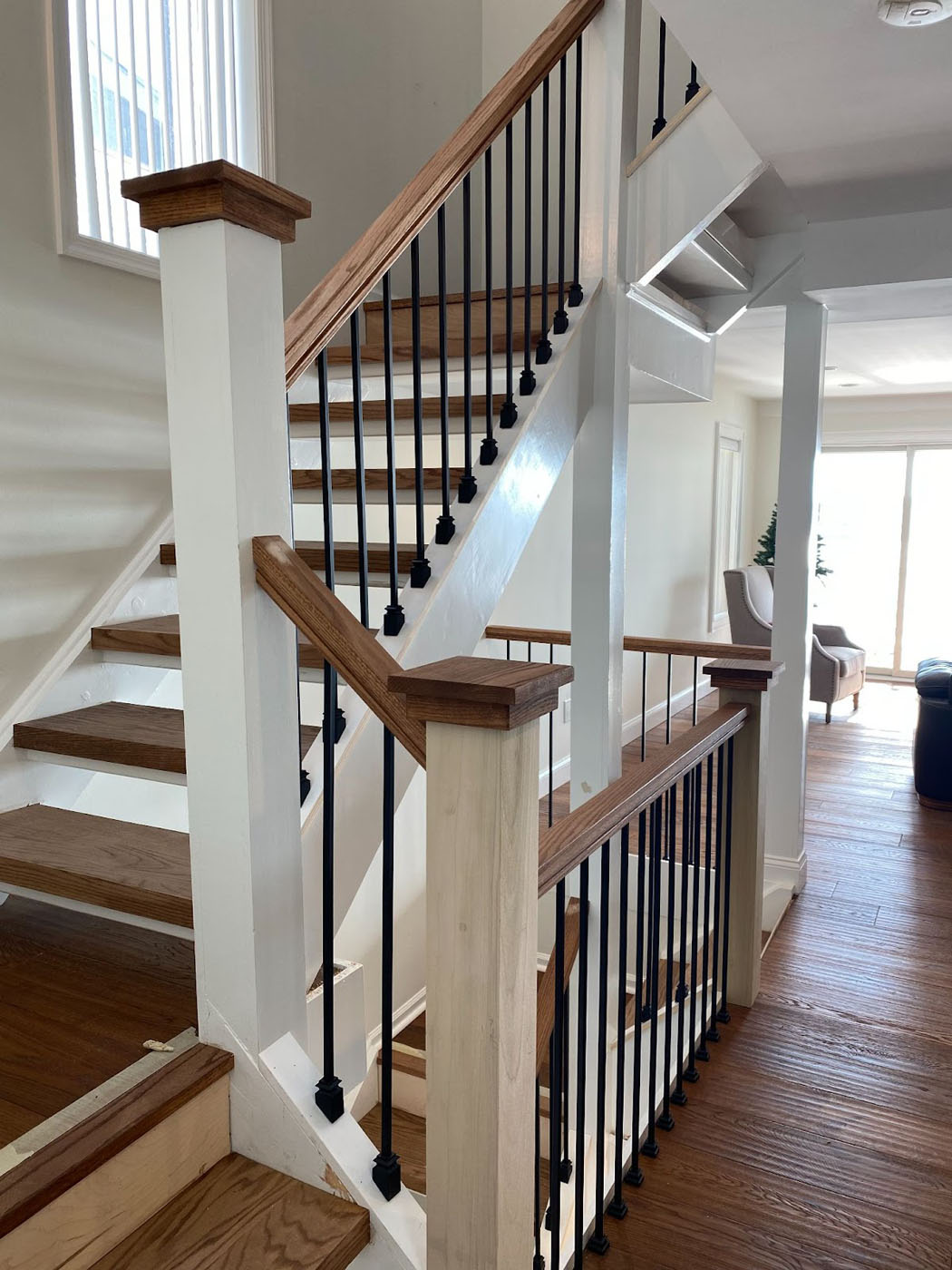 An image of beautiful hardwood floors and staircase from Footprints Floors Miami / Broward.