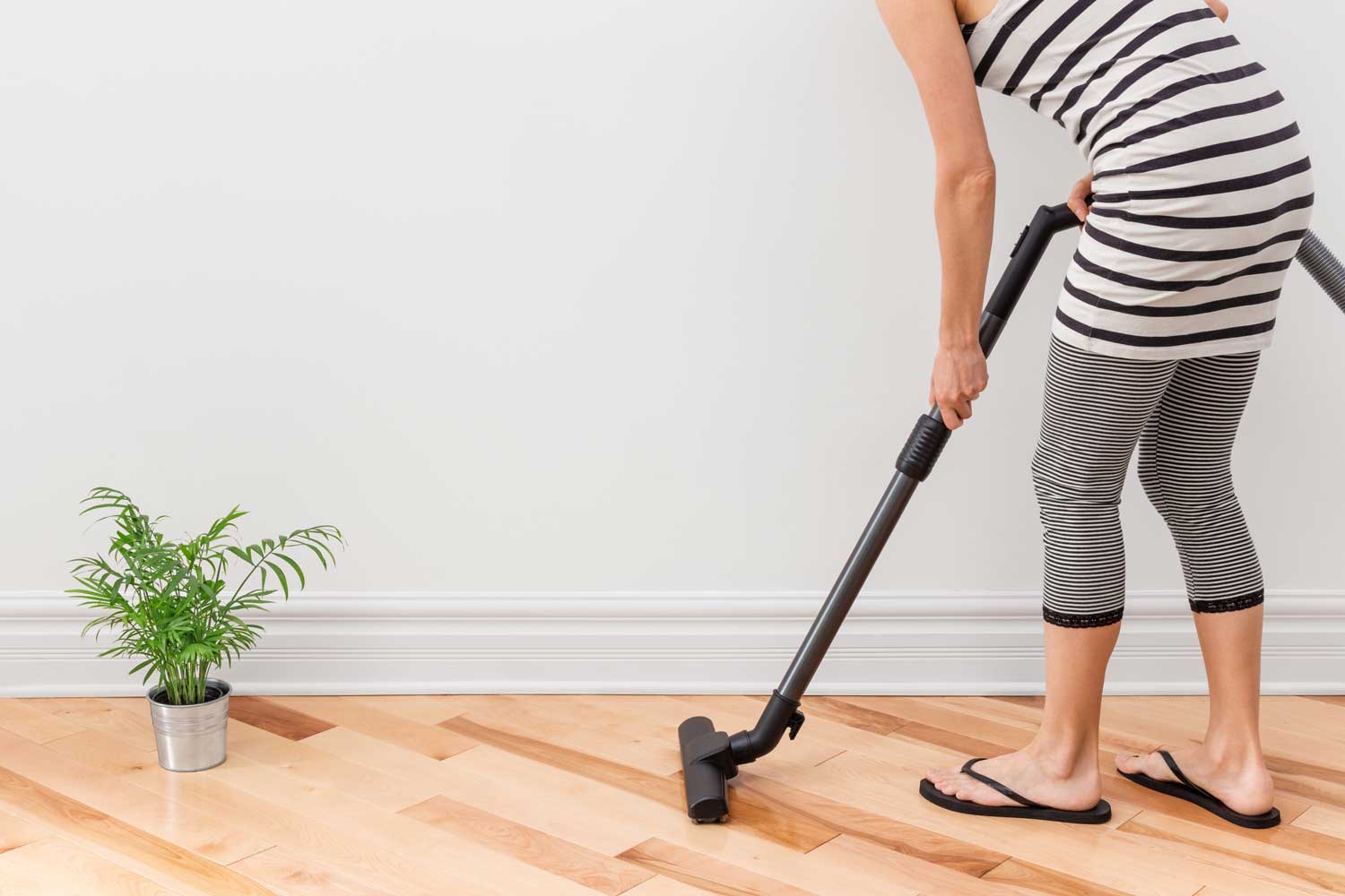 Regulary vacuum or sweep floors to remove dirt and keep your home floors looking amazing - tips from Footprints Floors in Scottsdale / Mesa .