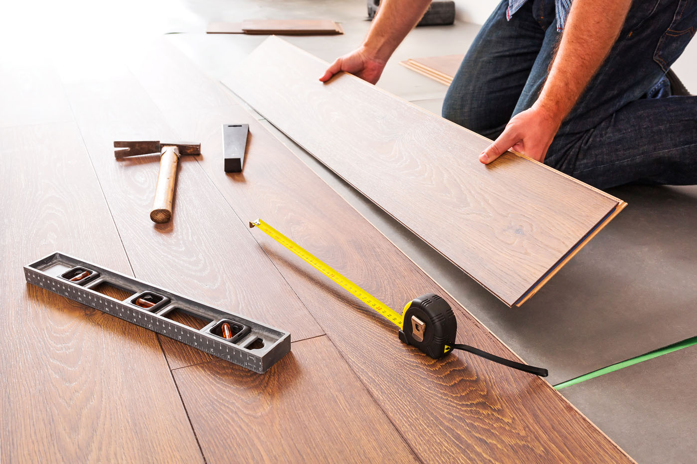 An image of a flooring contractors installing floors.