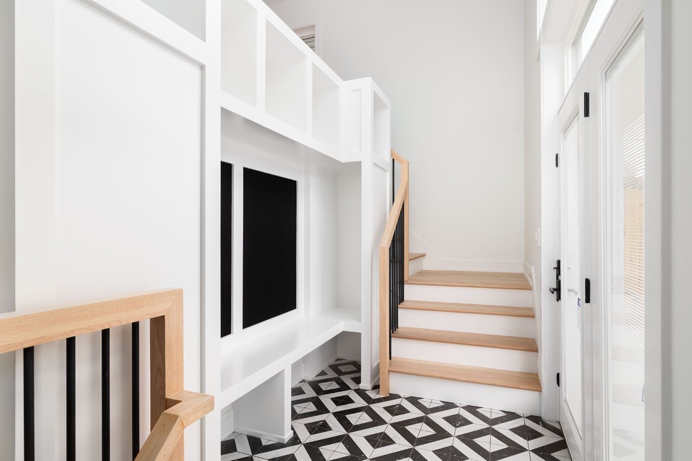 A tile job done in a mudroom space - add a mudroom backsplash installation with Footprints Floors to protect your walls.