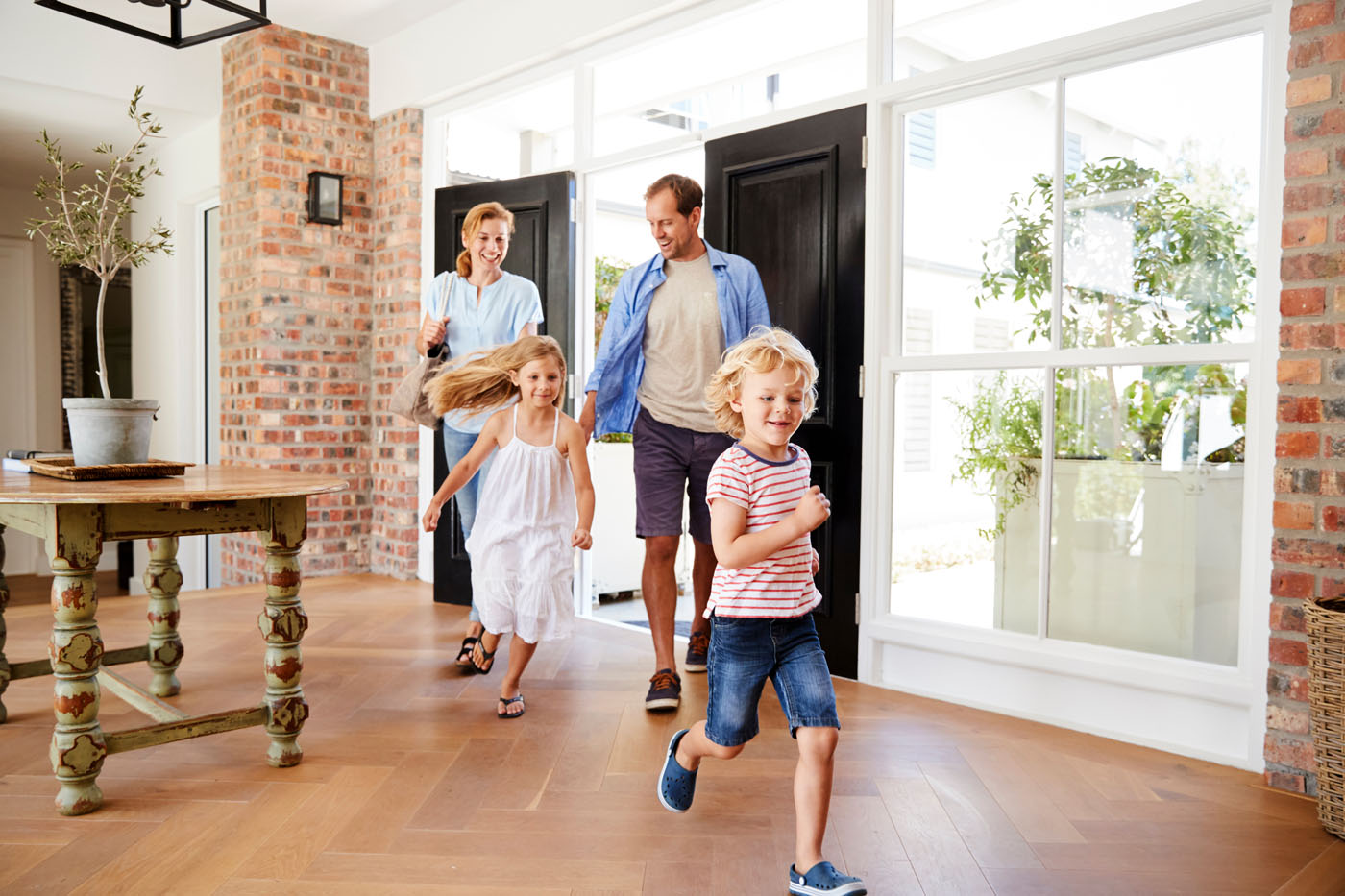 An image of a family enjoying their beautiful hardwood floors.