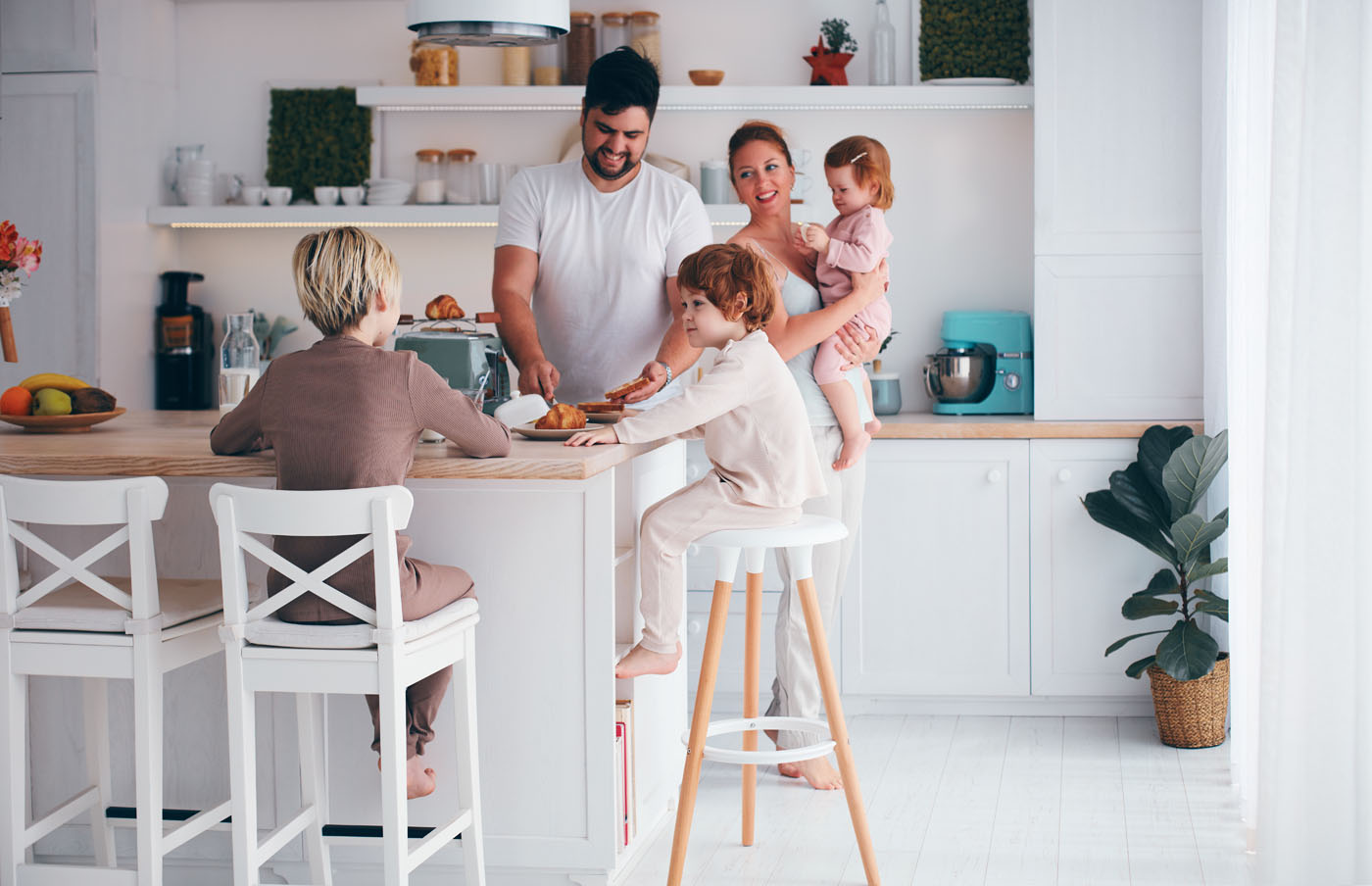 A family spending time in their kitchen which has new tile installed by Footprints Floors, one of the best tile installation companies in Reno-Sparks Metro, NV.