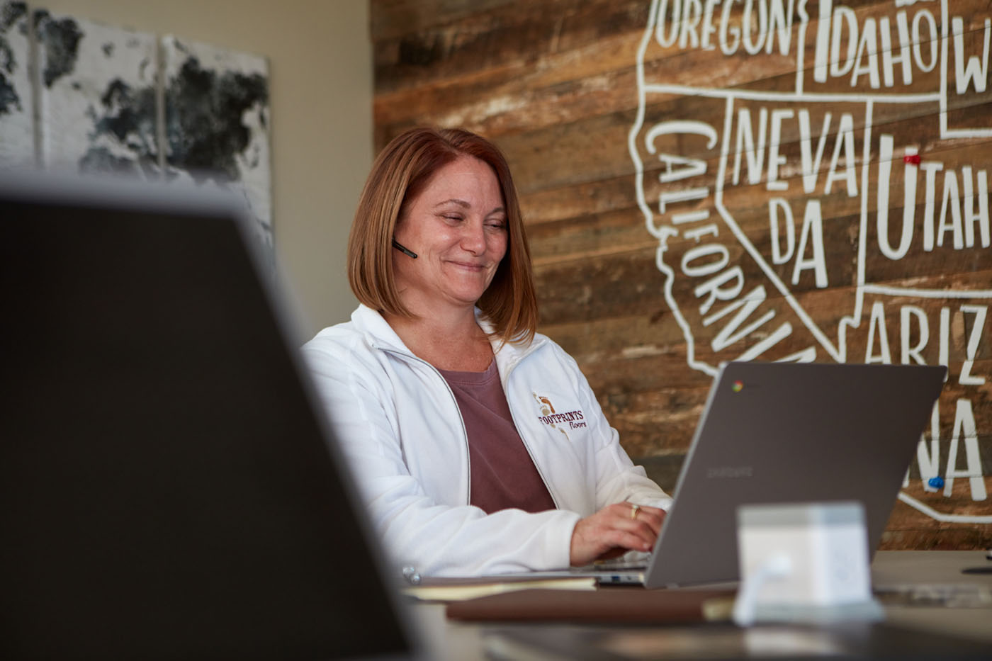 Footprints Floors of the MidSouth customer service team member answering a call.