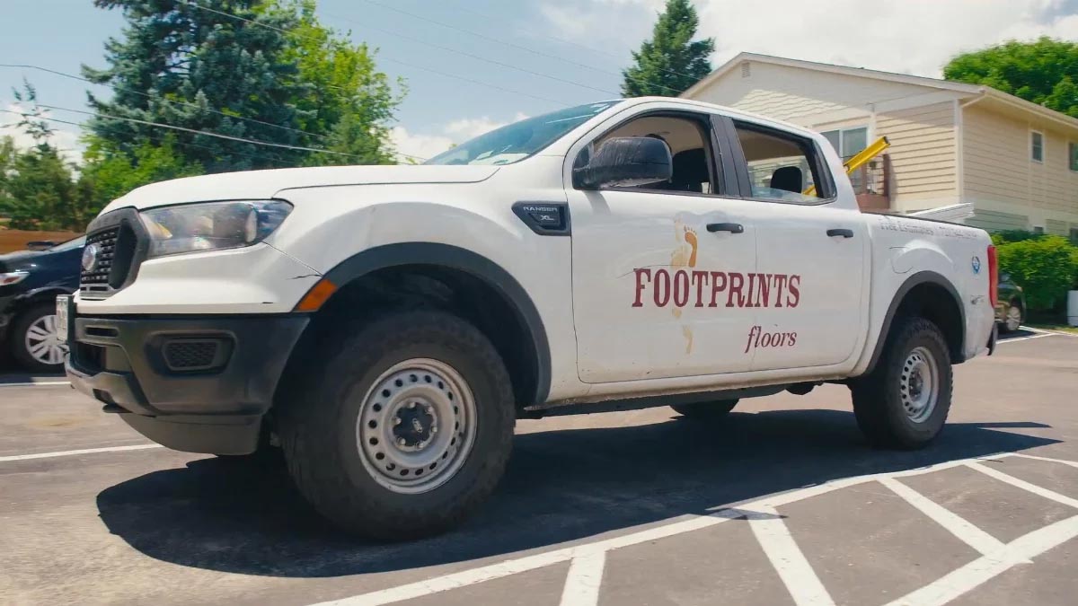 An image of a Footprints Floors truck, whose team is the best Reno-Sparks Metro tile installers.