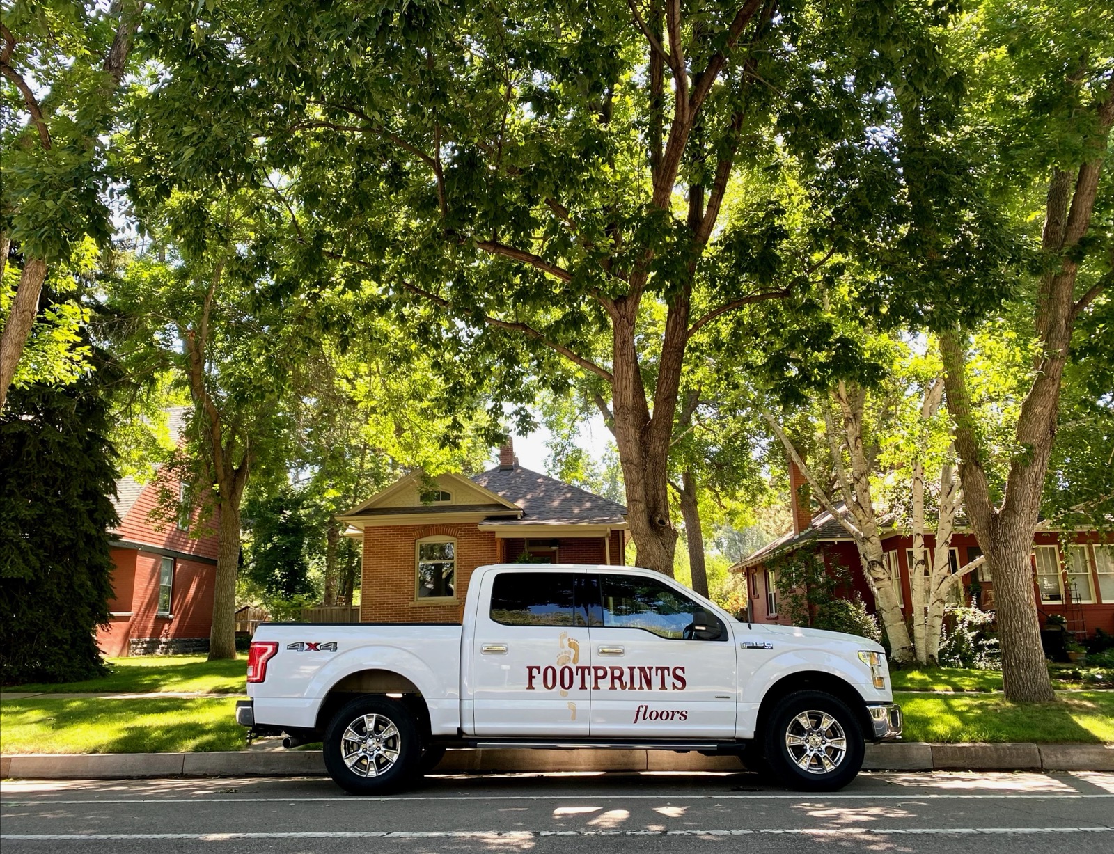 An image of a Footprints Floors vehicle - find a city serviced by Footprints Floors of the MidSouth near you and schedule your free consultation today!
